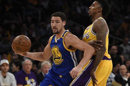 Klay Thompson dribbling across during a game against the Los Angeles Lakers.